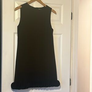 INA little black dress size medium with a slight ruffle at bottom
